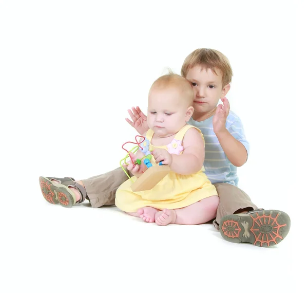 Young sister and brother over white — Stock Photo, Image