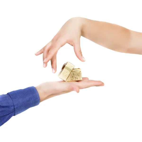 Female hand taking a gift over white Royalty Free Stock Photos