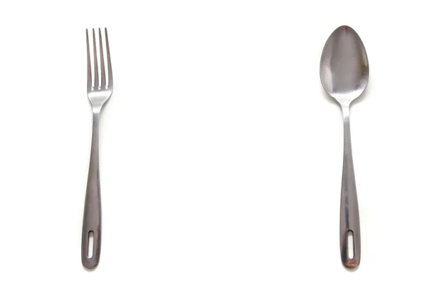 Spoon and fork over white — Stock Image Spoon and fork over white Royalty Free Stock Images