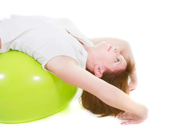 Girl on fitness ball over white — Stock Photo, Image