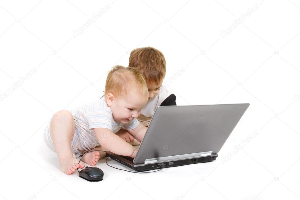two children with laptop over white