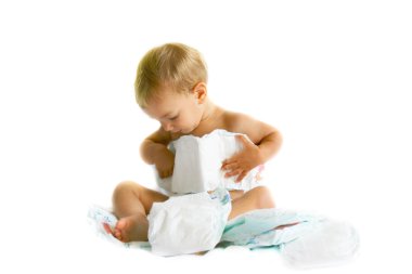 baby playing with diapers over white clipart