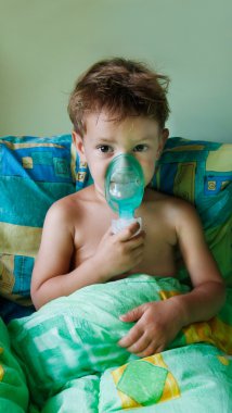 close up of child making inhalation