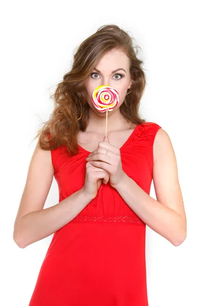 Retrato de mujer joven atractiva con gran piruleta sobre blanco — Foto de Stock