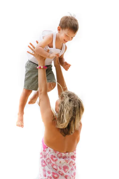 Feliz mãe e filho brincando sobre branco — Fotografia de Stock