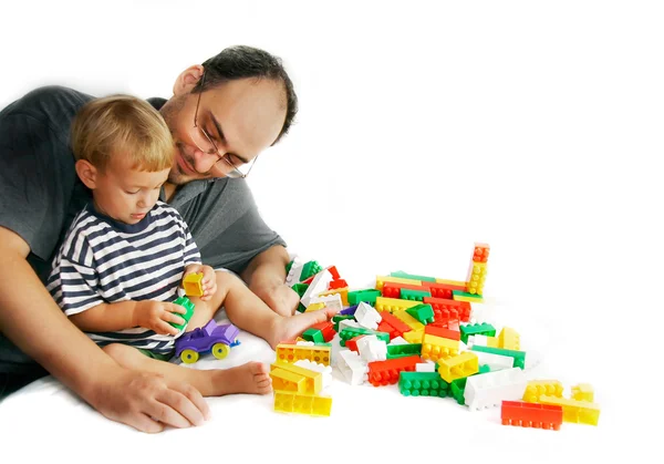 Fahter and son playing with construction set — Stock Photo, Image