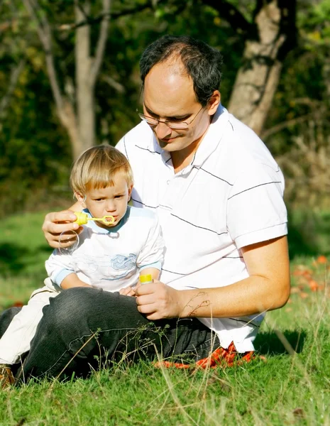 Father and son in the park — Stock Photo, Image