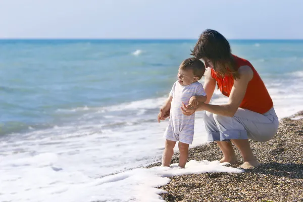 Mother and son on beach — Stock Photo, Image