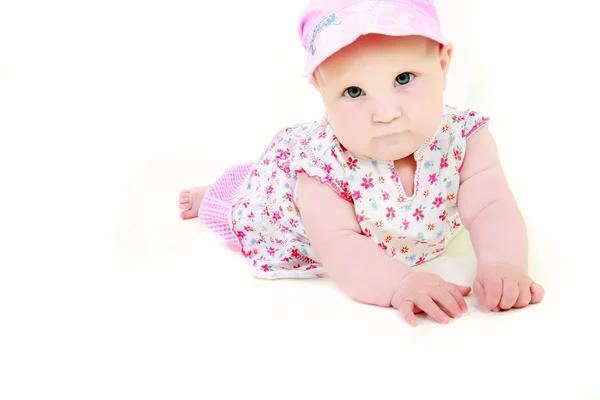 Bebê bonito em roupas rosa sobre branco — Fotografia de Stock