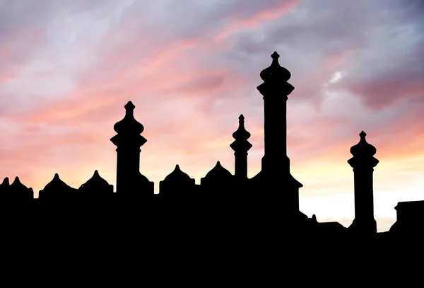 Castle silhouette on sunset sky background — Stock Photo, Image