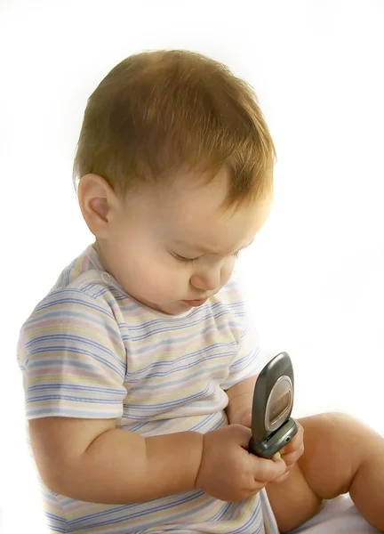 Menino com telefone celular sobre branco — Fotografia de Stock