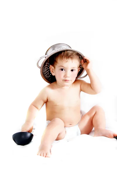 Toddler in colander hat over white — Stock Photo, Image