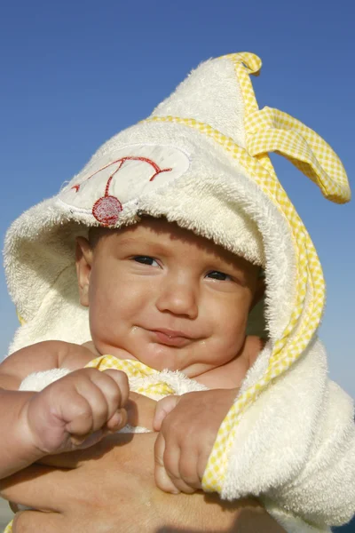 Baby in towel after swimming — Stock Photo, Image