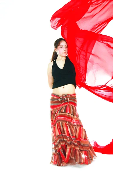 Dancing girl with red scarf in action over white — Stock Photo, Image