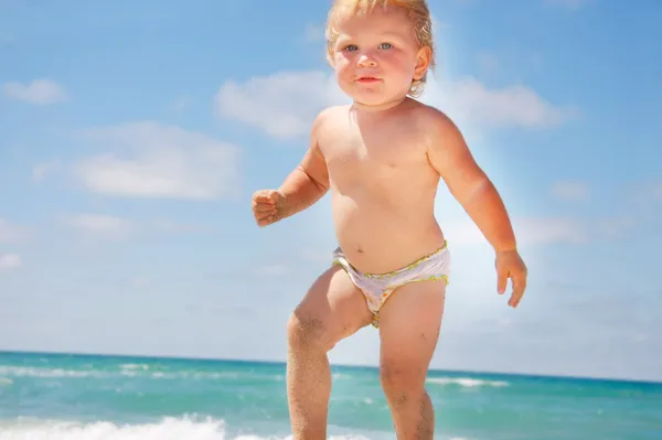 Close up of toddler on sea and sky background — Stock Photo, Image