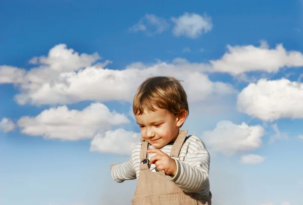 Happy boy running over sky background — Stock Photo, Image