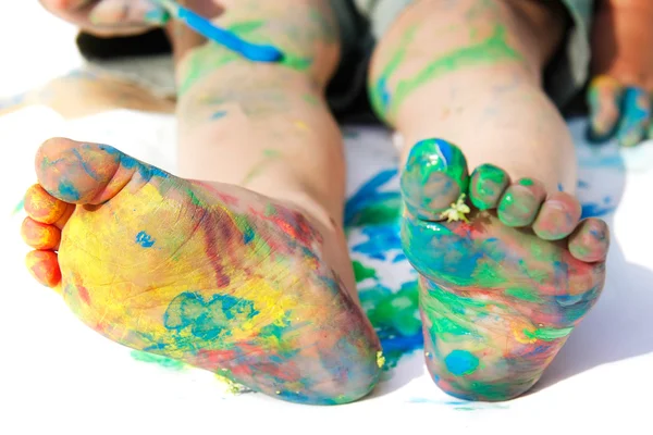 Colored child's feet over white — Stock Photo, Image