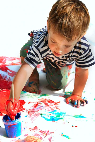 Young boy painting over white — Stock Photo, Image