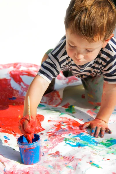 Young boy painting over white — Stock Photo, Image