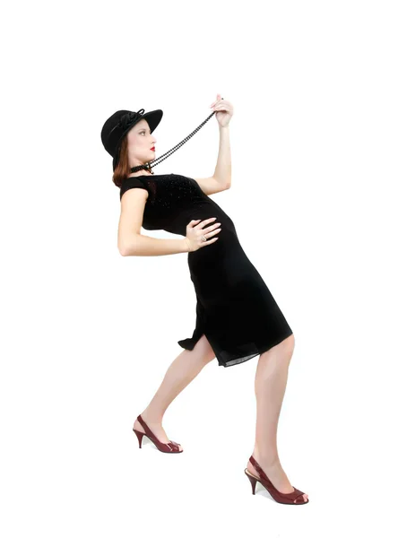 Attractive woman in black dress and hat over white — Stock Photo, Image