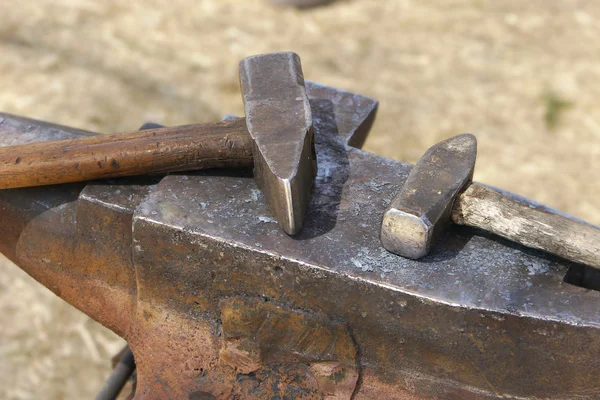 Two hammers on anvil — Stock Photo, Image