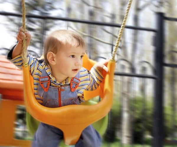 Swinging baby boy — Stock Photo, Image