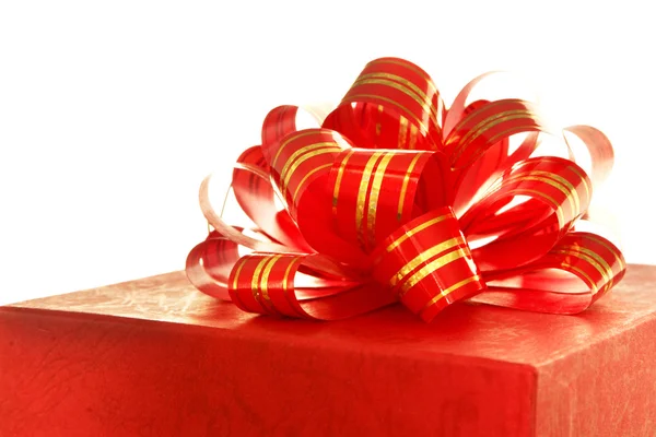 Red ribbon and gift box over white background — Stock Photo, Image