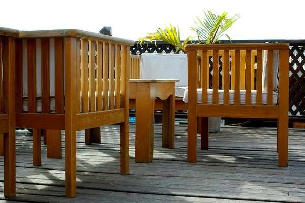 Wooden chairs and table in terrace cafe — Stock Photo, Image