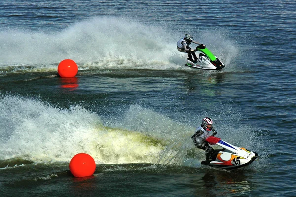 Two jetskis riding from red balls — Stock Photo, Image