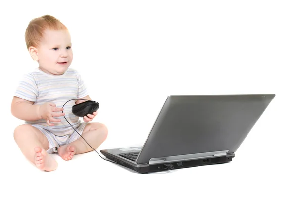 Cute toddler with laptop over white — Stock Photo, Image