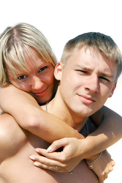Молода щаслива пара над білим — стокове фото