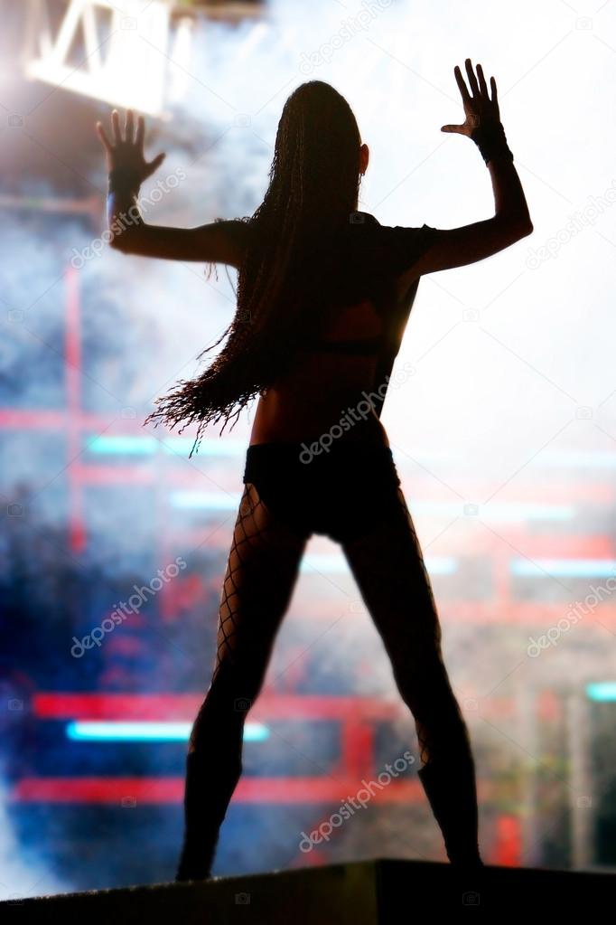Dancing girl in night club