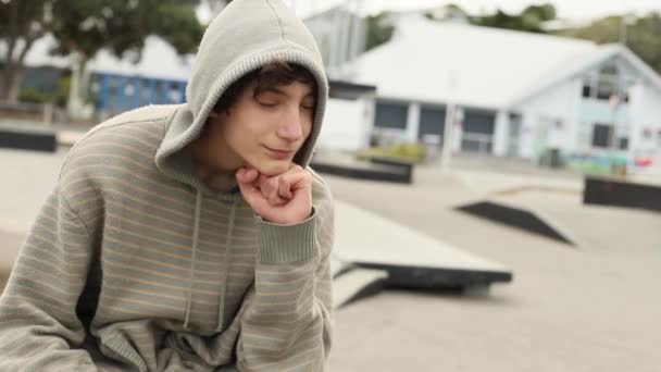 Portrait of teenager boy on natural background — Stock Video