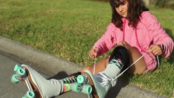 Portrait of young child or teen girl roller skating outdoors, fitness, wellbeing, active healthy lifestyle, video clip — Stock Video