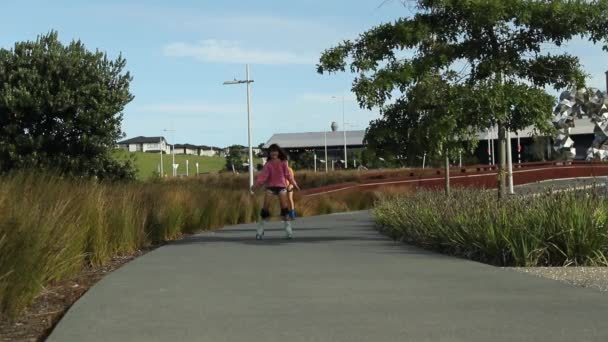 Portrait of young child or teen girl roller skating outdoors, fitness, wellbeing, active healthy lifestyle, video clip — Stock Video