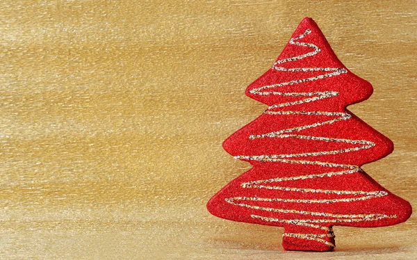Kerstboom decoratie op gouden achtergrond — Stockfoto