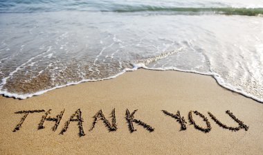 thank you word drawn on the beach sand clipart