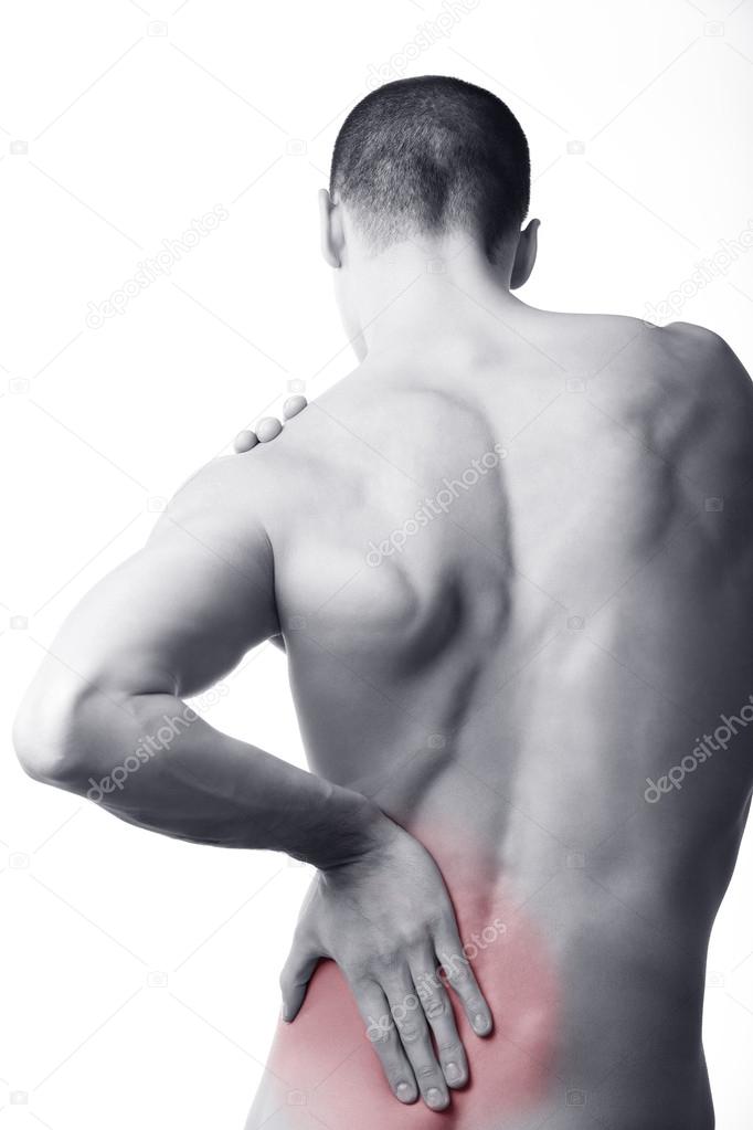 Young man with back pain in the red zone
