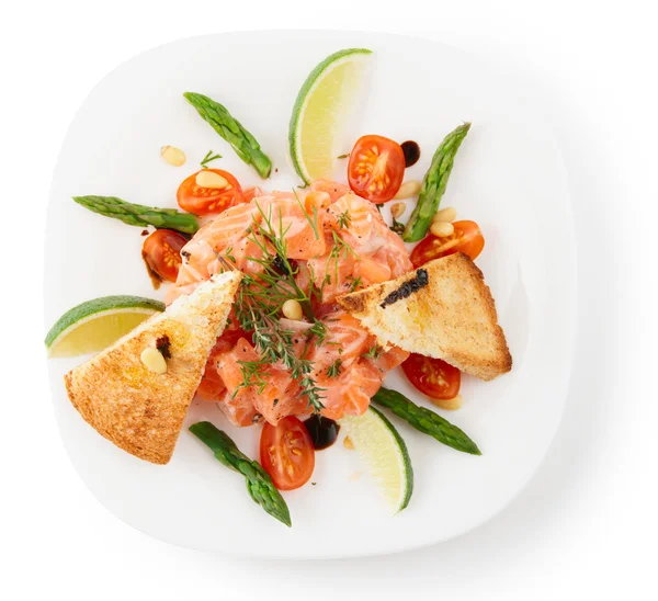 Salmon carpaccio on light grey surface — Stock Photo © Serreitor 20562793