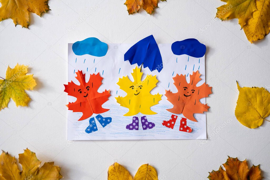 Autumn paper art crafts. Childrens fall crafts and creativity. Creative Activities, Cut Paper Art, Easy Crafts for Kids. Tree and branch made from paper and dry yellow leaves.