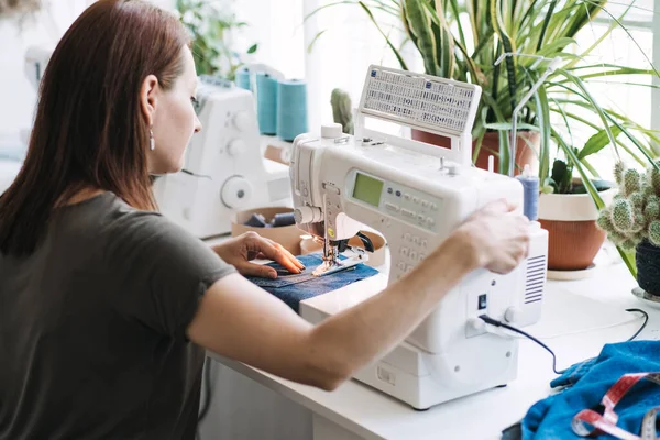 Support local business, small business. Run Own Sewing startup. Start full time business, make extra money with sewing side hustle. Woman owner of sewing business in home studio — Fotografia de Stock