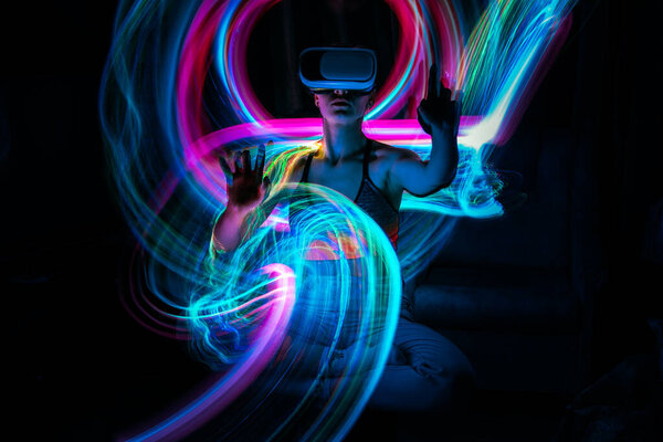 Metaverse digital Avatar, Metaverse Presence, digital technology, cyber world, virtual reality, futuristic lifestyle. Woman in VR glasses playing AR augmented reality NFT game with neon blur lines — Stock Photo, Image