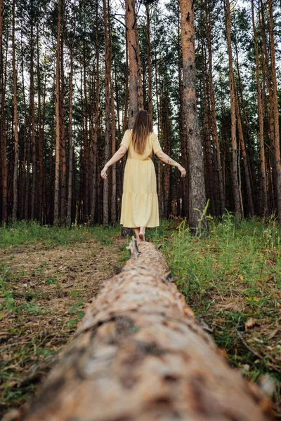 Midsummer solstice ritual. Celebrating summer solstice. Significance of the solstice in Paganism. Woman with long hair dance on nature background