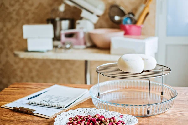 Confectionery Small Business Order List Tracker Pages. Sweet shop, pastry-shop handwritten order list with customer names on table in home office, kitchen