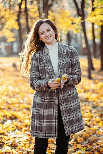 Autumn skin care beauty health tips. Autumn Skincare haircare tips. Happy beautiful blonde woman with long hair having fun in fall sunny city park