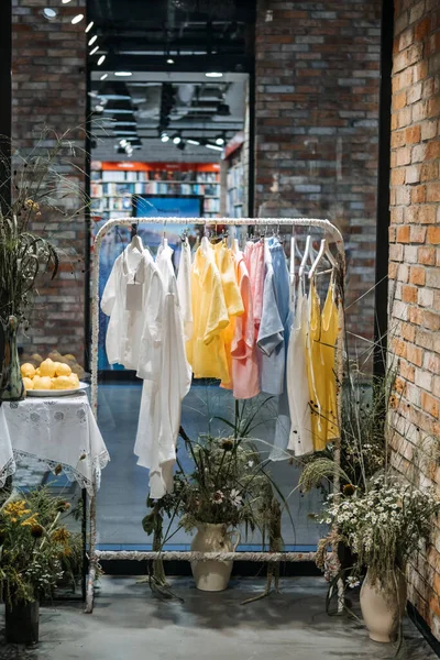 Sustainable fashion, slow fashion. Close Up Shot of Clothing Rack with linen natural clothes made of 100 cotton linen organic materials.