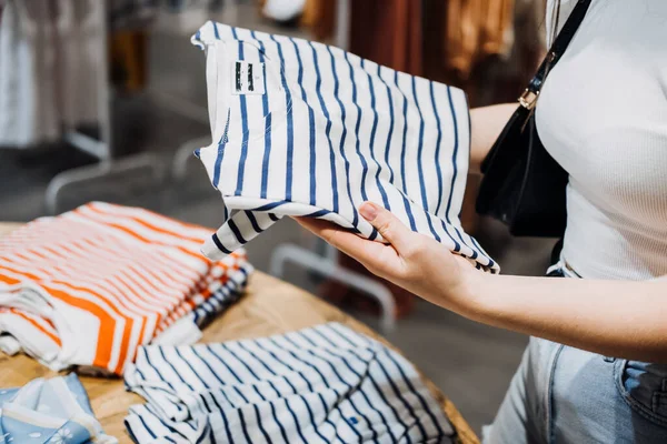 Modern Latina Young Woman Choosing 100 Percent Organic Cotton Wear — Stok fotoğraf