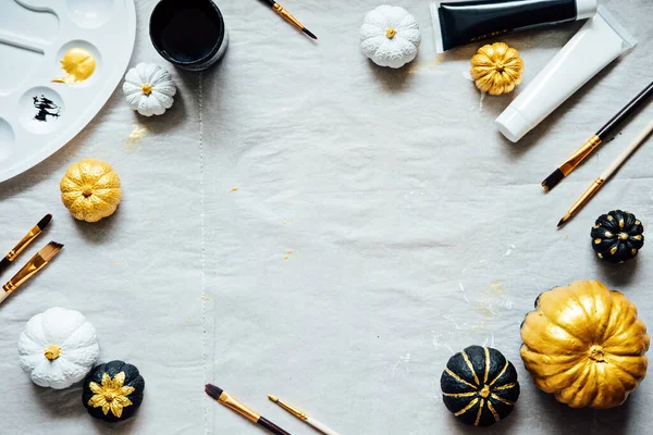 Creative pumpkin painting ideas for Halloween and Thanksgiving for adults. Simple easy Pumpkin decorating kit with Black Gold White Pumpkins, brushes, paints.