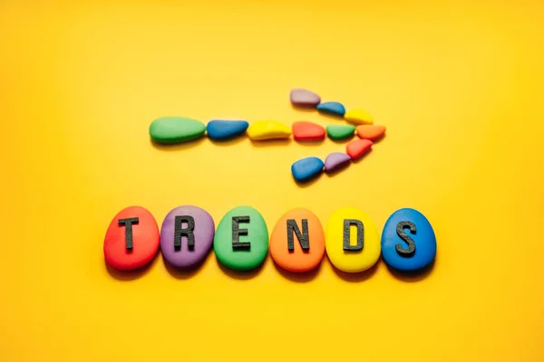 Word trends with colored blocks on yellow background. Modern trend concept banner for monitoring new business opportunities