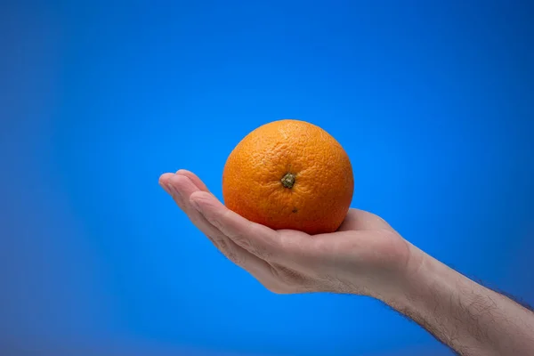 Ripe Unpeeled Orange Fruit Held Hand Caucasian Male Close Studio — Stock Photo, Image